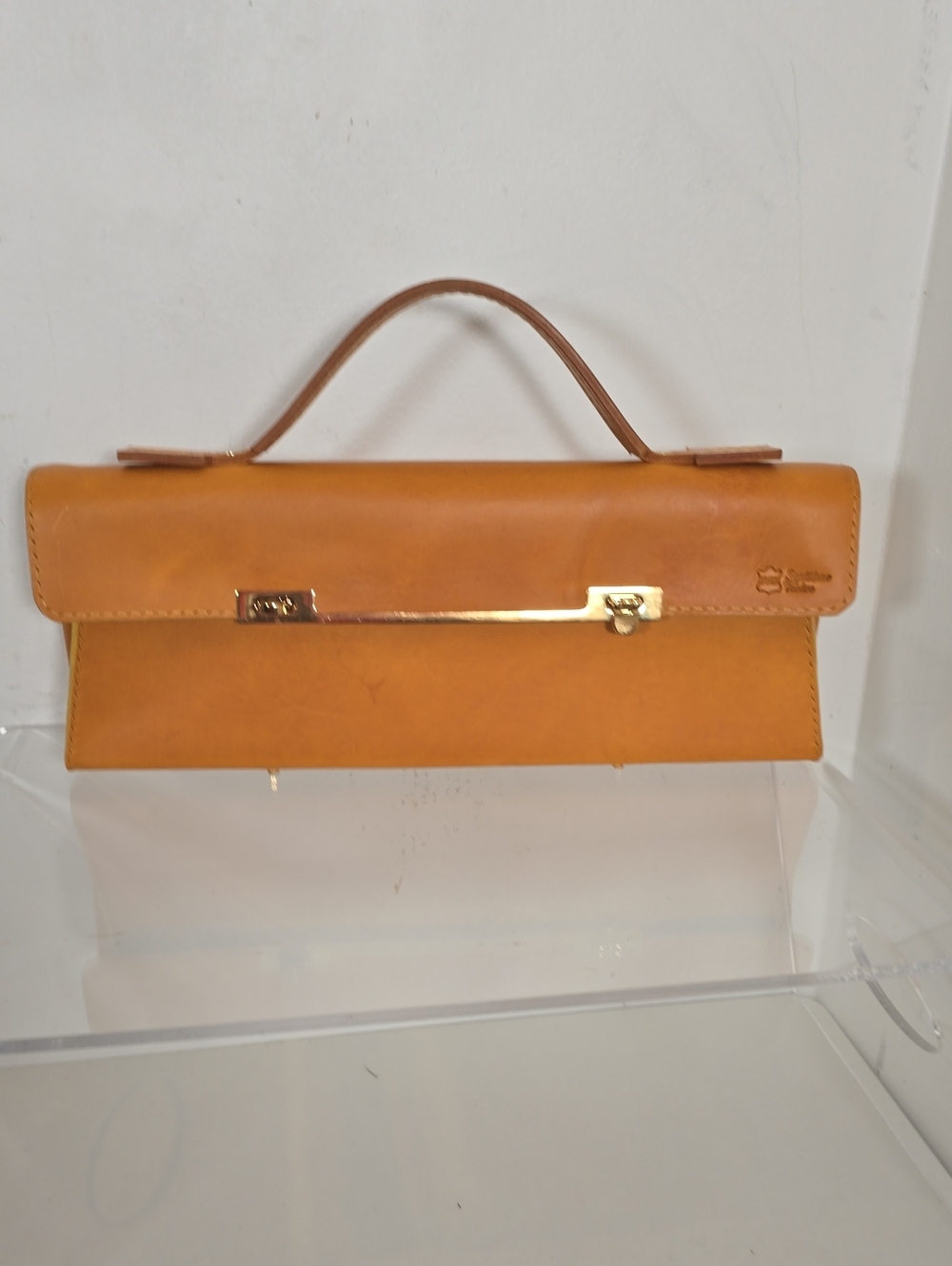 Classic Tan Leather Top-Handle Clutch with Gold Bar Accent